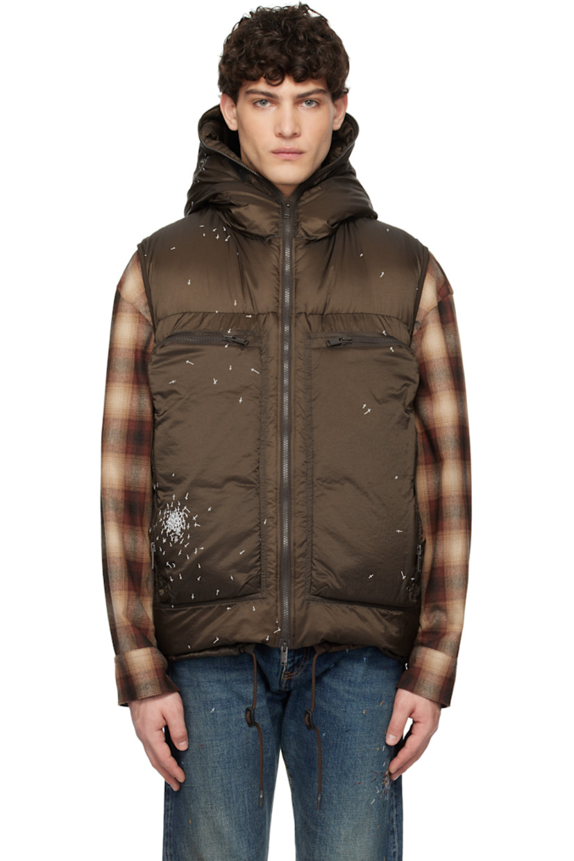 Down-filled and quilted nylon satin vest. Graphics printed throughout.

· Mesh trim at hood
· Two-way zip closure extends to hood
· Eyelet at zip pockets
· Cord-lock drawstring at hem
· Elasticized armscyes
· Patch pockets at interior
· Fully lined

Supplier color: Brown

Fill: 90% down, 10% feather.