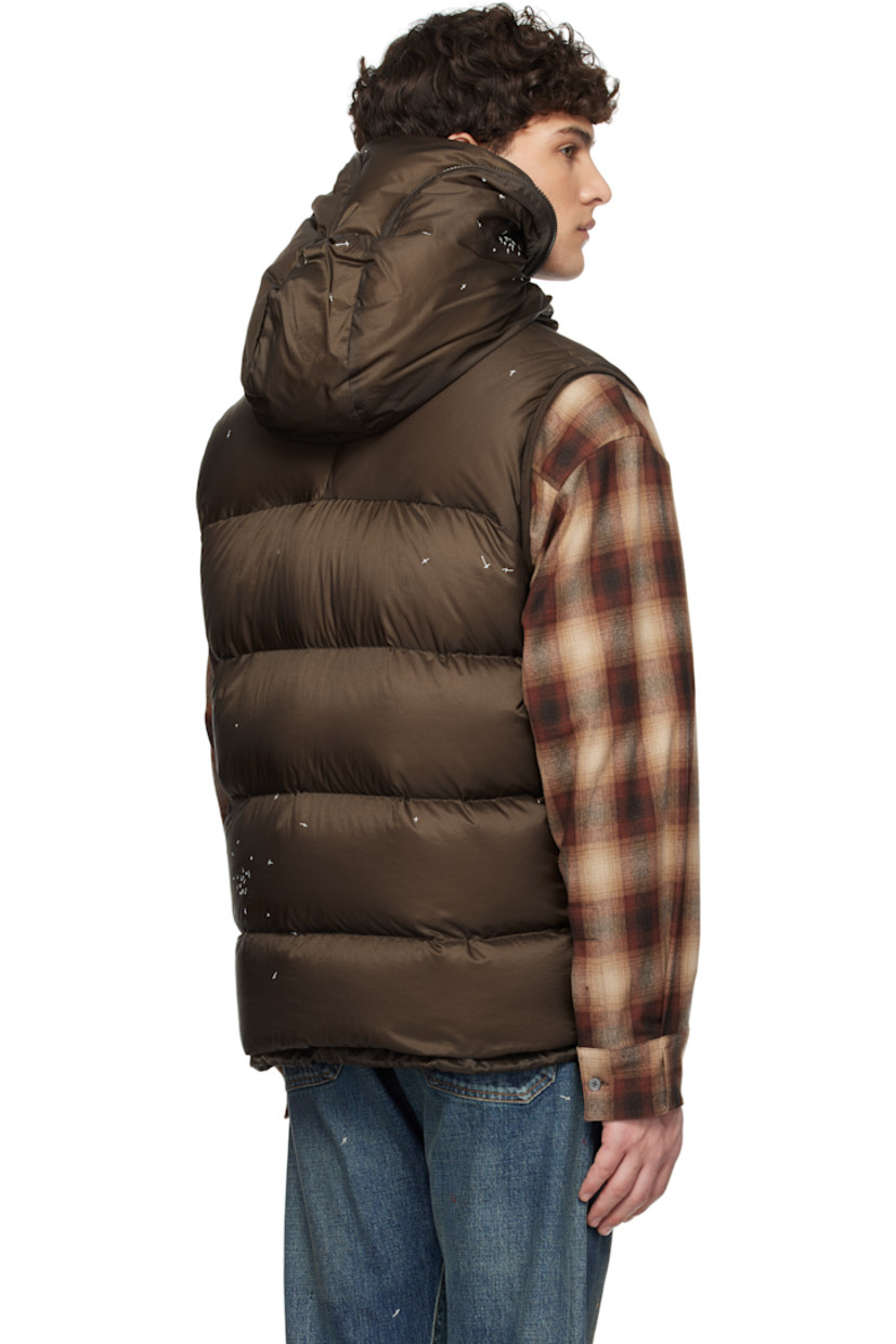 Down-filled and quilted nylon satin vest. Graphics printed throughout.

· Mesh trim at hood
· Two-way zip closure extends to hood
· Eyelet at zip pockets
· Cord-lock drawstring at hem
· Elasticized armscyes
· Patch pockets at interior
· Fully lined

Supplier color: Brown

Fill: 90% down, 10% feather.