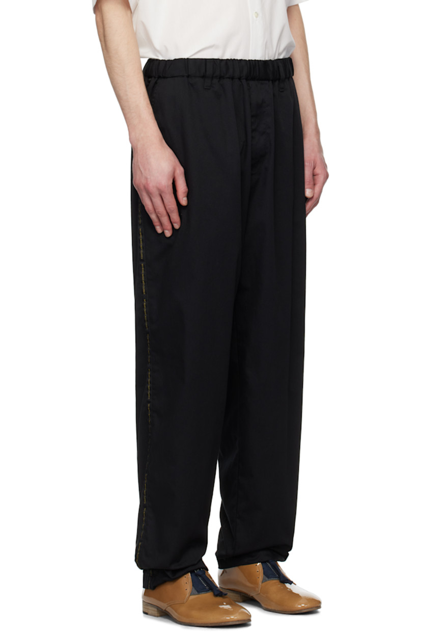Polyester- and cotton-blend twill trousers.

· Concealed drawstring at elasticized waistband
· Belt loops
· Four-pocket styling
· Zip-fly
· Text-woven stripe at outseams

Supplier color: Black