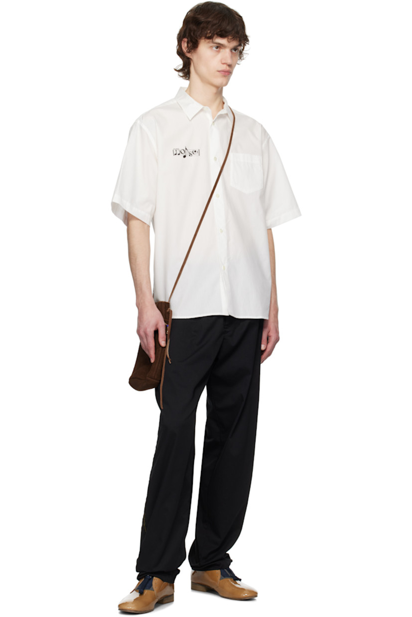 Polyester- and cotton-blend twill trousers.

· Concealed drawstring at elasticized waistband
· Belt loops
· Four-pocket styling
· Zip-fly
· Text-woven stripe at outseams

Supplier color: Black