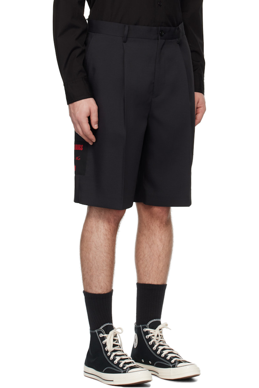 Polyester twill shorts.

· Belt loops
· Four-pocket styling
· Zip-fly
· Pleats at front
· Appliqué at leg and outseam
· Creased legs

Supplier color: Black