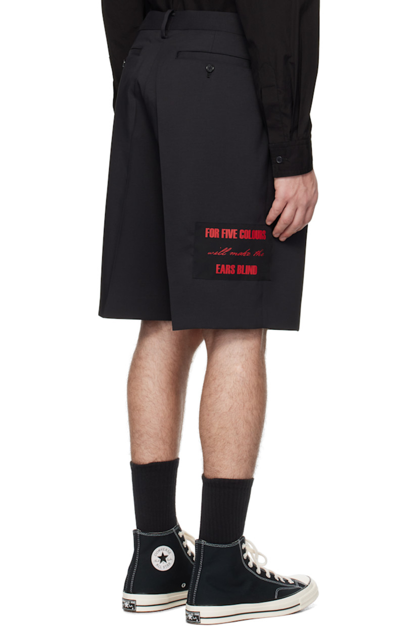 Polyester twill shorts.

· Belt loops
· Four-pocket styling
· Zip-fly
· Pleats at front
· Appliqué at leg and outseam
· Creased legs

Supplier color: Black
