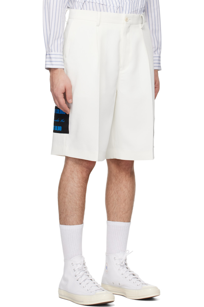 Polyester twill shorts.

· Belt loops
· Four-pocket styling
· Zip-fly
· Pleats at front
· Appliqué at leg and outseam
· Creased legs

Supplier color: White