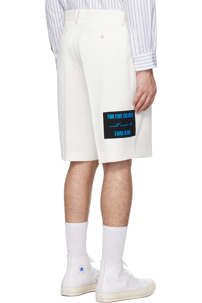Polyester twill shorts.

· Belt loops
· Four-pocket styling
· Zip-fly
· Pleats at front
· Appliqué at leg and outseam
· Creased legs

Supplier color: White