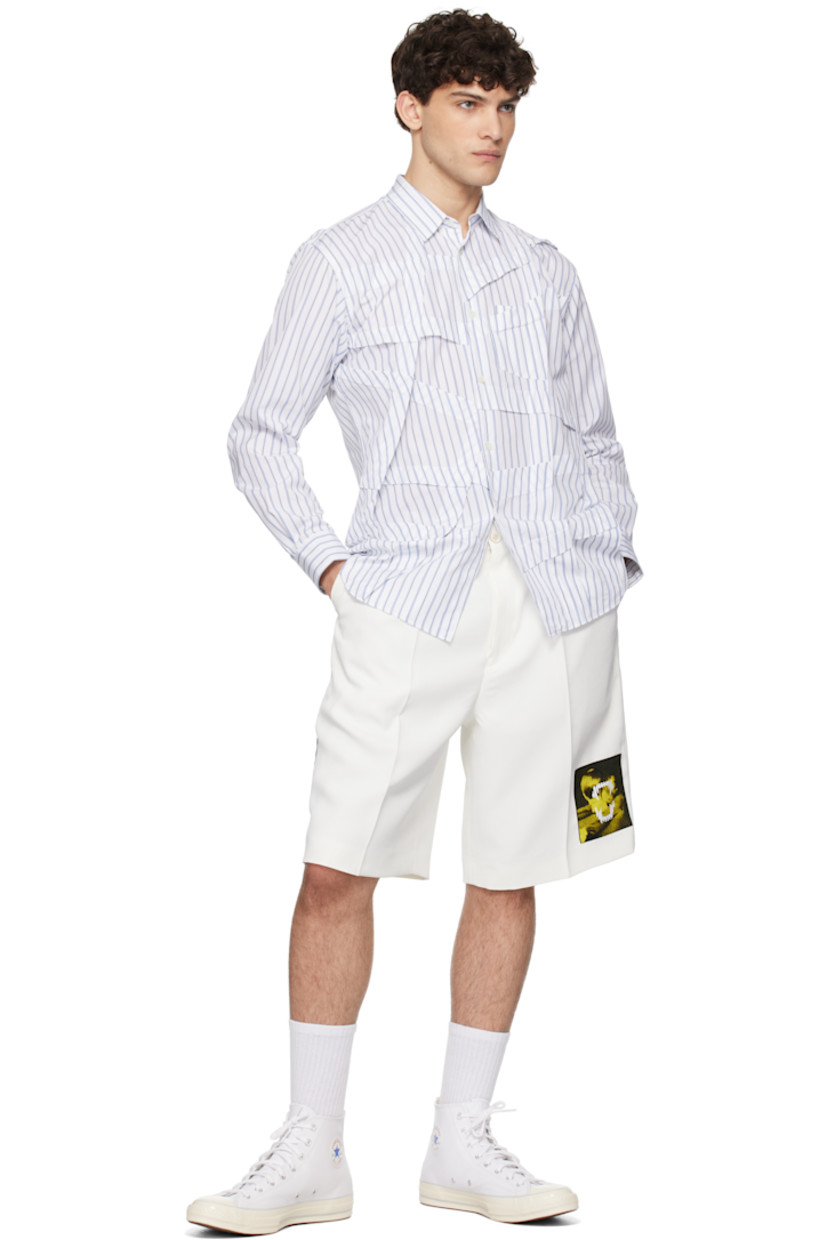 Polyester twill shorts.

· Belt loops
· Four-pocket styling
· Zip-fly
· Pleats at front
· Appliqué at leg and outseam
· Creased legs

Supplier color: White
