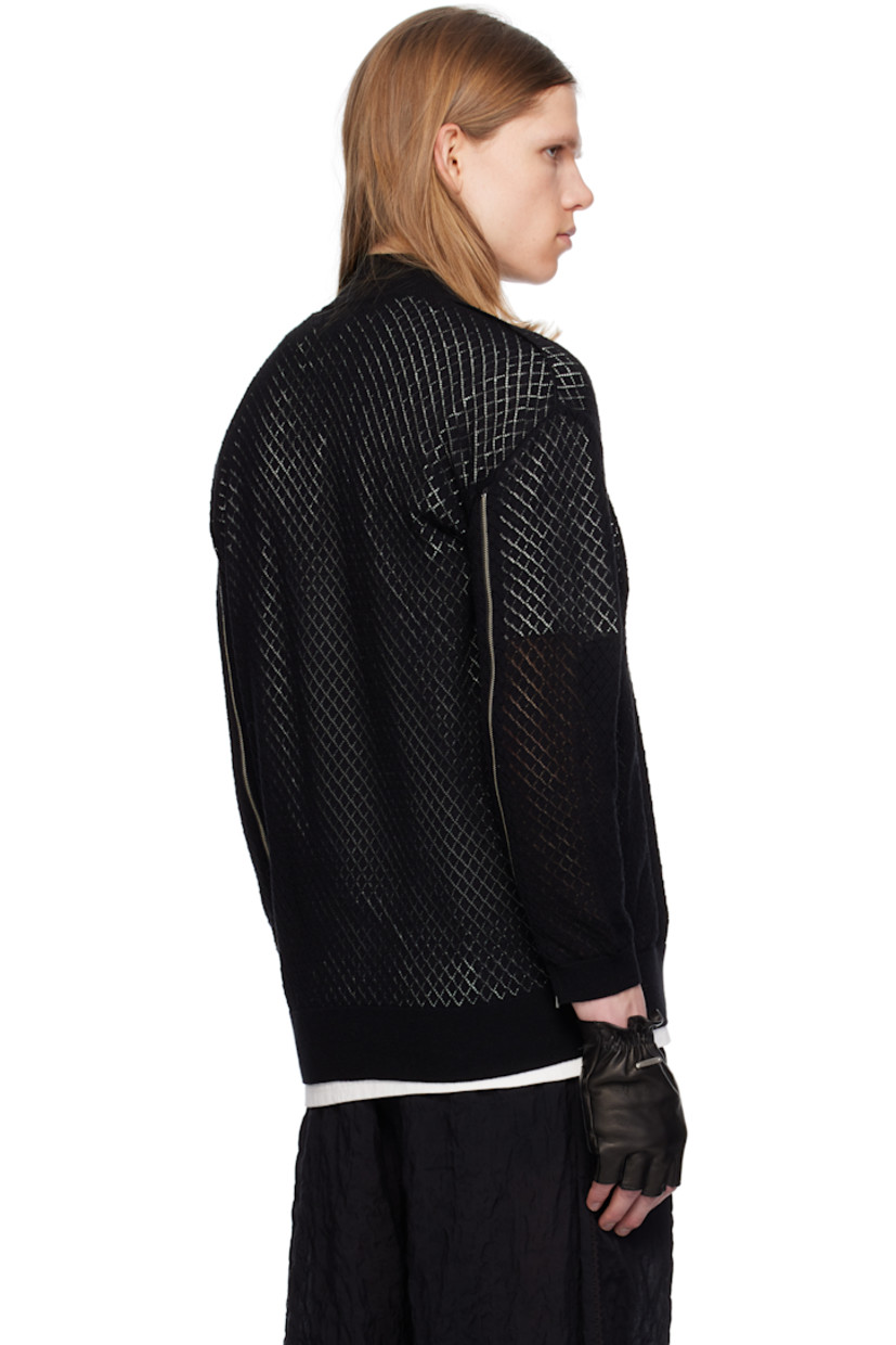 Pointelle-knit cotton- and cashmere-blend sweater. 

· Rib-knit mock neck, hem, and cuffs
· Patch pocket at chest
· Exposed seam at sides and sleeves
· Zip vent at cuffs extends to dropped shoulders

Supplier color: Black