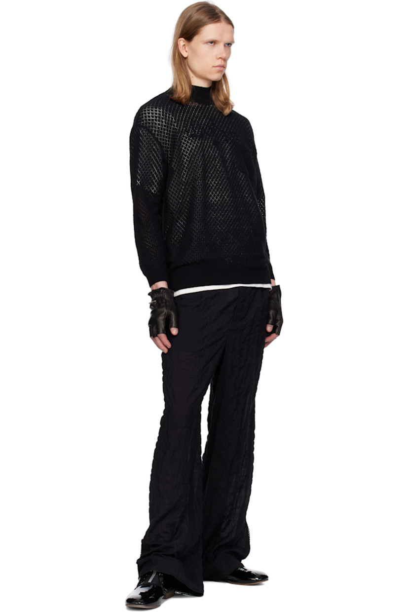 Pointelle-knit cotton- and cashmere-blend sweater. 

· Rib-knit mock neck, hem, and cuffs
· Patch pocket at chest
· Exposed seam at sides and sleeves
· Zip vent at cuffs extends to dropped shoulders

Supplier color: Black