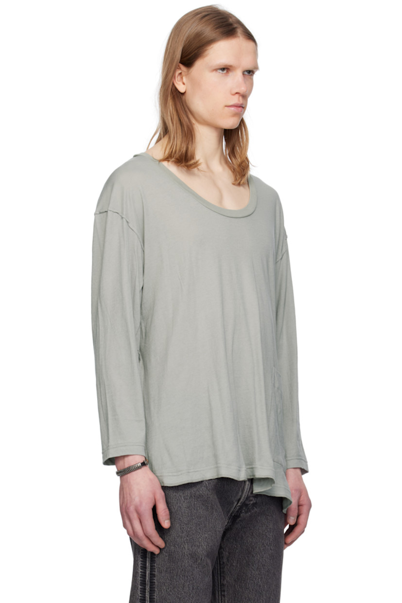 Cotton jersey T-shirt. Exposed seams with raw edges throughout.

· Rib-knit scoop neck 
· Patch pocket at front
· Overlock stitching at asymmetrical hem
· Dropped shoulders

Supplier color: Gray