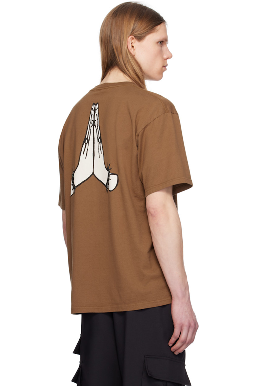 Cotton jersey T-shirt. 

· Rib-knit crewneck
· Text printed at chest
· Dropped shoulders
· Graphic printed at back

Supplier color: Brown