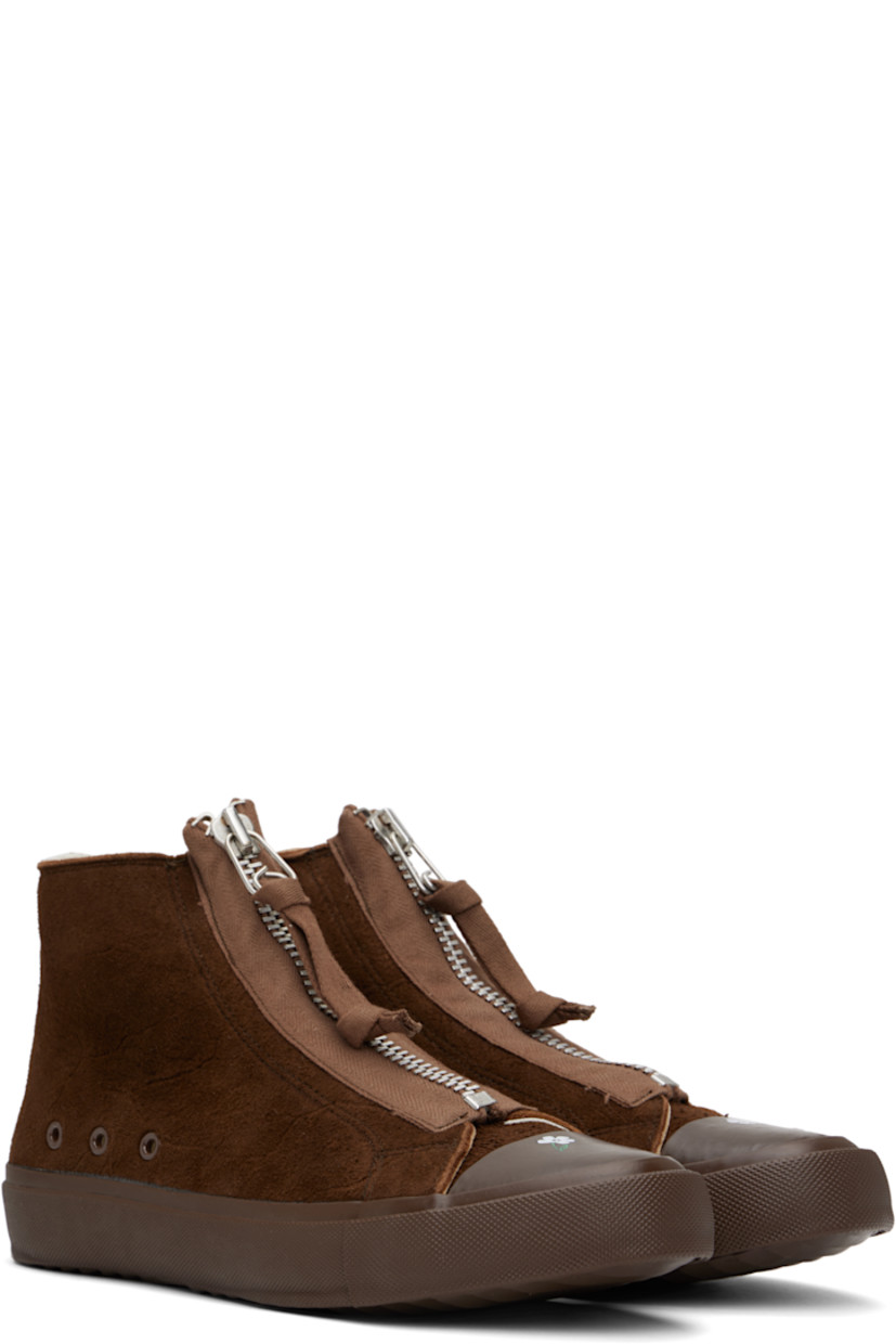 High-top brushed deerskin suede sneakers in brown.

· Graphic printed at rubber cap toe 
· Zip closure at vamp
· Grommets at sides
· Canvas lining 
· Logo patch at heel
· Textured rubber midsole 
· Treaded rubber sole 

Supplier color: Brown