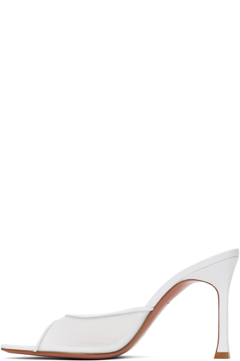 Semi-sheer mesh heeled sandals in white.

· Open pointed square toe
· Logo-embossed padded goatskin footbed
· Leather stiletto heel with rubber injection
· Polished leather sole with rubber injection
· Heel: H3.75"

Supplier color: White mesh