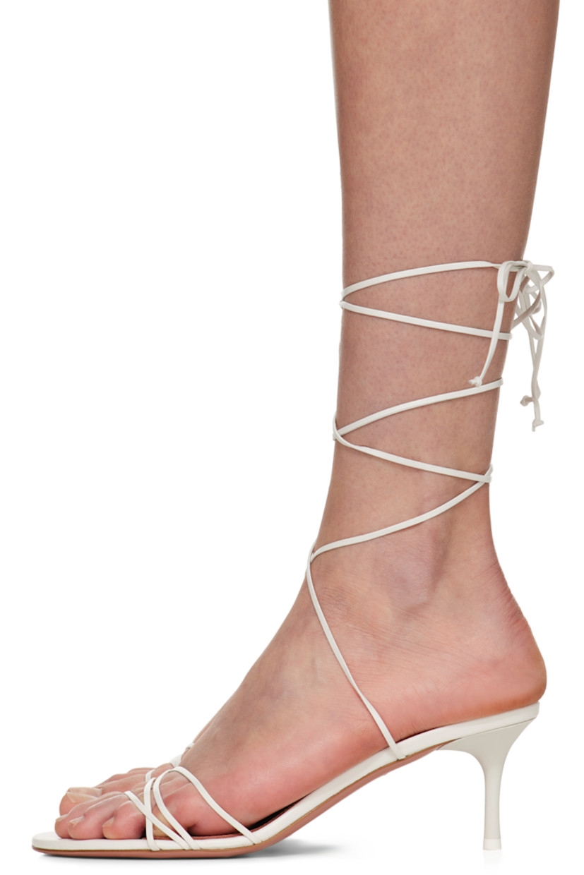 Nappa lambskin heeled sandals in white.

· Open toe
· Crisscrossing straps at vamp
· Self-tie wraparound ankle straps
· Logo embossed at padded goatskin footbed
· Covered kitten heel with rubber injection
· Leather sole
· Heel: H2.5"

Supplier color: White nappa