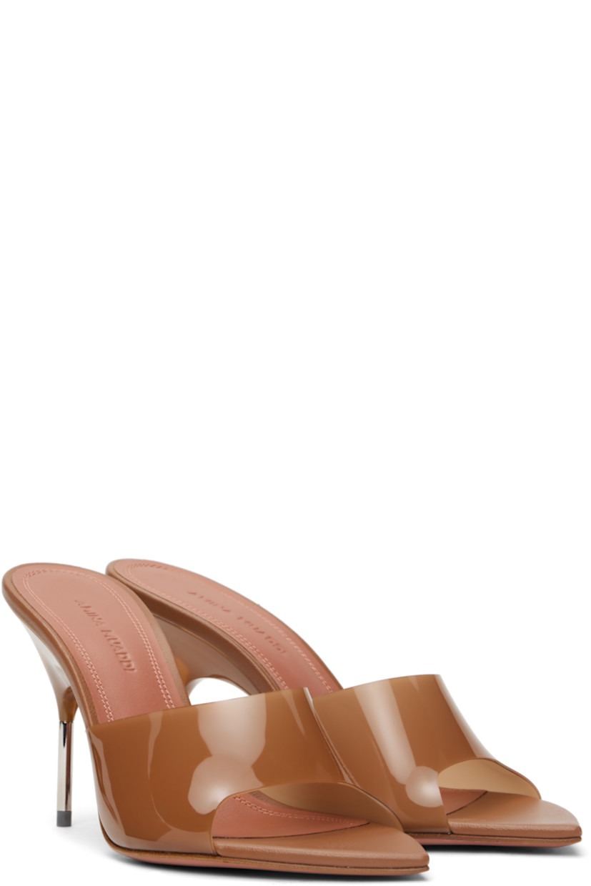 Semi-transparent vinyl mules in beige.

· Open pointed toe
· Strap at vamp
· Buffed leather footbed
· Stiletto heel with rubber injection
· Smooth leather sole with rubber injection
· Heel: H3.25"

Supplier color: Latte PVC/Shiny silver