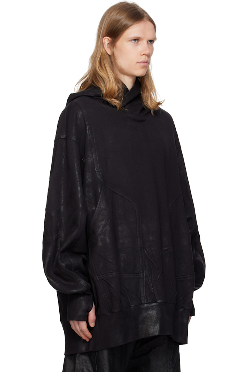 Oversized coated French terry hoodie.

· Paneled construction
· Patch pockets
· Rib-knit hem and cuffs
· Dropped shoulders
· Thumbhole at cuffs

Supplier color: Black