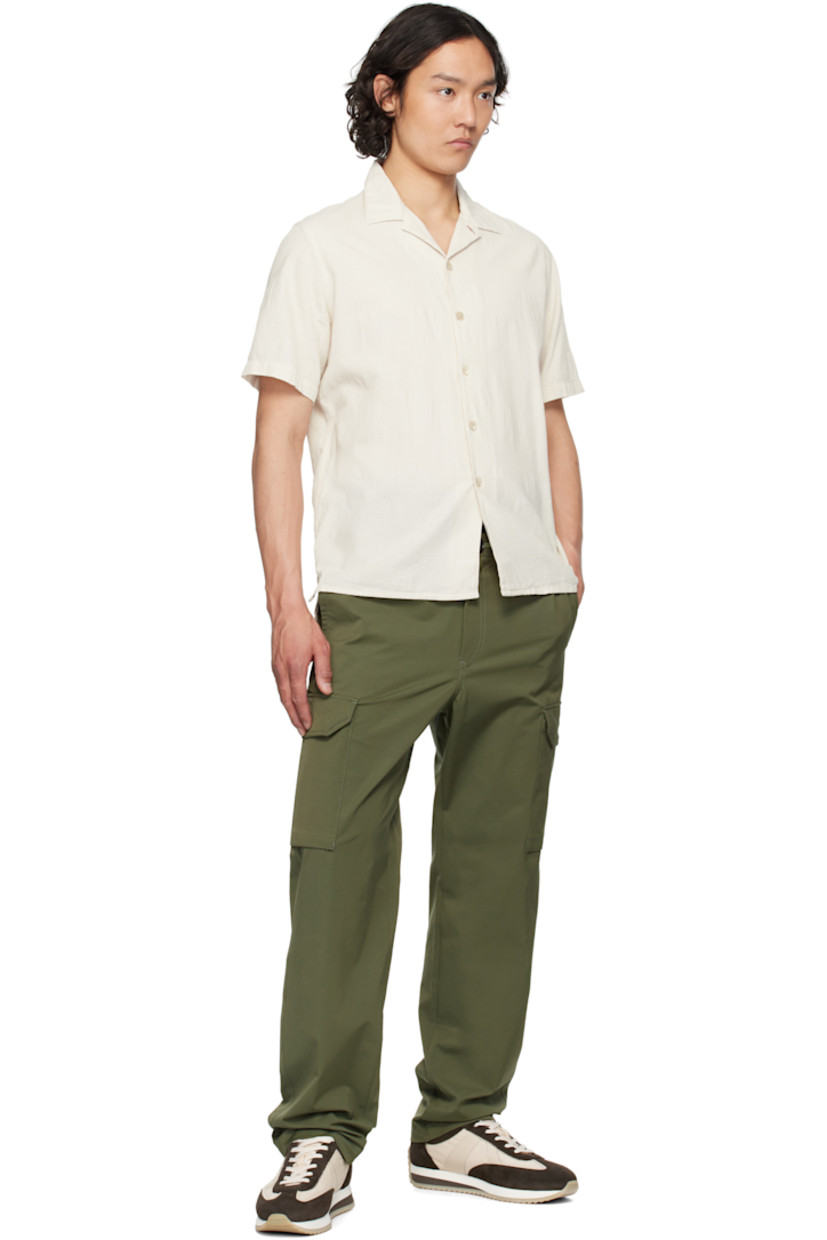 Cotton gauze shirt. Jacquard check pattern throughout.

· Open spread collar
· Button closure
· Logo flag at side seam
· Tennis-tail hem
· Dropped shoulders
· Mother-of-pearl hardware

Supplier color: White