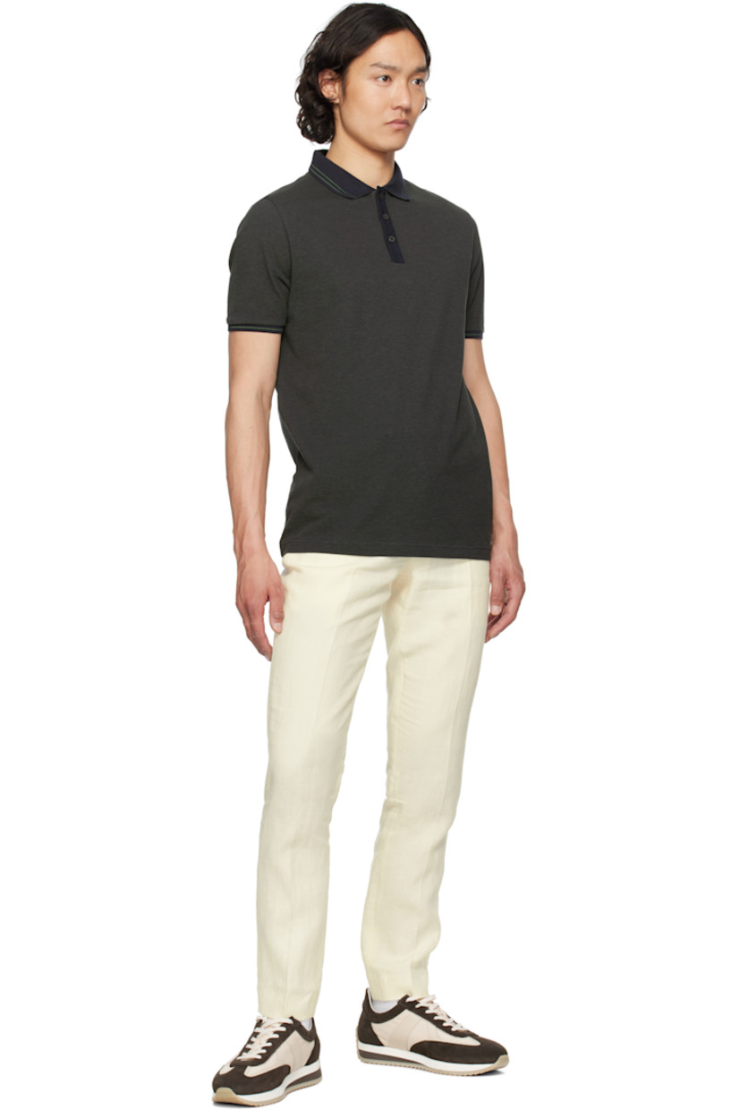GOTS-certified organic cotton piqué polo. Jacquard graphic pattern throughout.

· Stripes at rib-knit spread collar and cuffs
· Three-button placket
· Logo flag at side seam
· Mother-of-pearl hardware

Supplier color: Blue