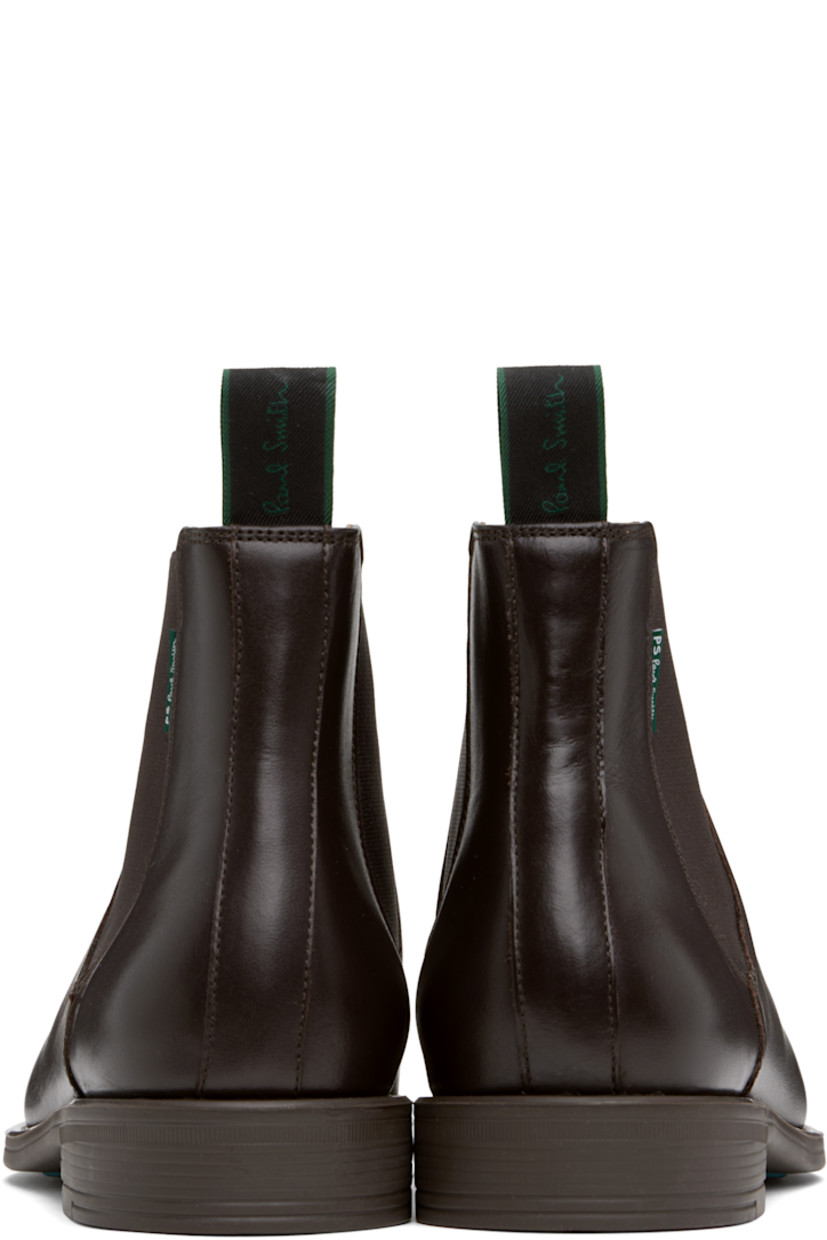 Ankle-high polished leather Chelsea boots in brown.

· Elasticized gusset at sides
· Logo-woven pull-loop at heel collar
· Logo flag at outer side
· Buffed leather lining
· Stacked rubber heel
· Crêpe rubber sole
· Heel: H1"

Supplier color: Brown