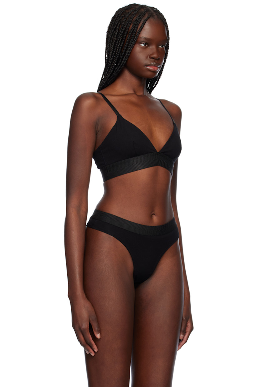 Stretch Tencel™ lyocell jersey bralette. Moisture-wicking.

· Plunging V-neck
· Herringbone trim at elasticized hem
· Adjustable shoulder straps convert to crisscrossing straps
· Jacquard logo at back
· Fully lined
· Logo-engraved silver-tone hardware

Supplier color: Black