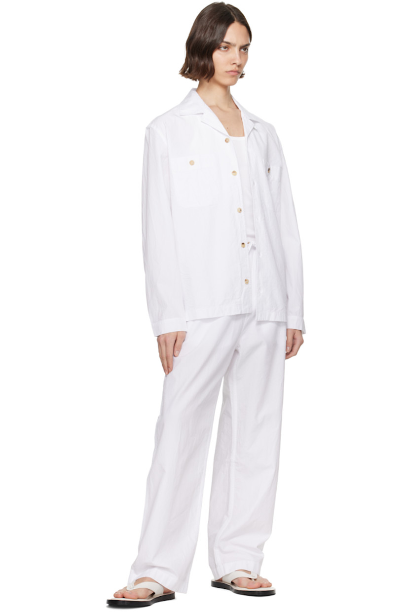 Crinkled organic cotton twill overshirt.

· Spread collar
· Button closure
· Patch pockets at chest
· Adjustable buttoned barrel cuffs
· Box pleat at back yoke
· Horn hardware

Supplier color: Off white