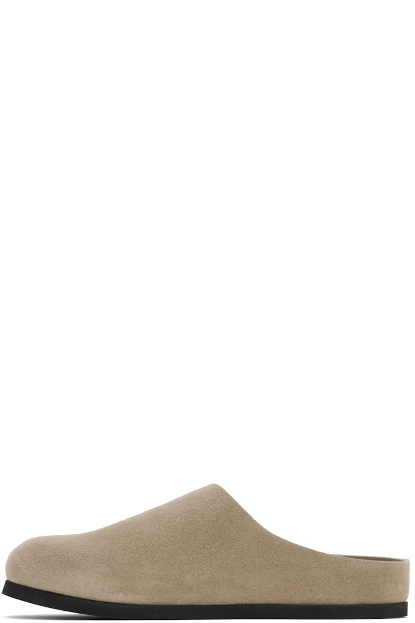 Suede slip-on loafers in taupe.

· Signature series embossed at outer side
· Logo stamp at molded suede footbed
· Buffed leather lining
· Rubber sole

Supplier color: Taupe