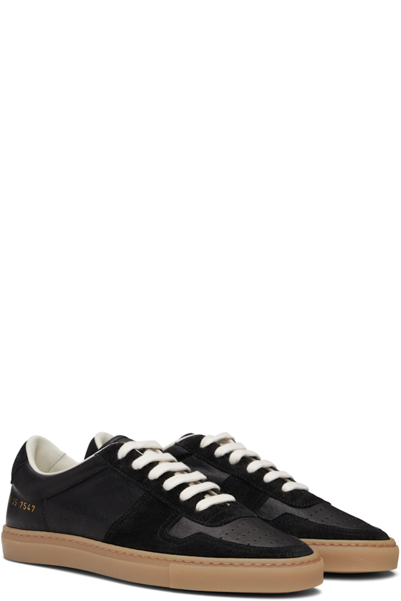 Low-top grained leather and suede sneakers in black.

· Perforations at toe and outer side
· Lace-up closure
· Padded tongue and collar
· Signature series stamp at outer side
· Buffed leather and mesh lining
· Treaded rubber sole

Supplier color: Black