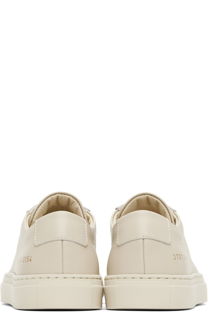 Low-top buffed leather sneakers in beige.

· Lace-up closure
· Padded tongue and collar
· Signature series stamp at outer side
· Buffed leather and mesh lining
· Treaded rubber sole

Supplier color: Cremino