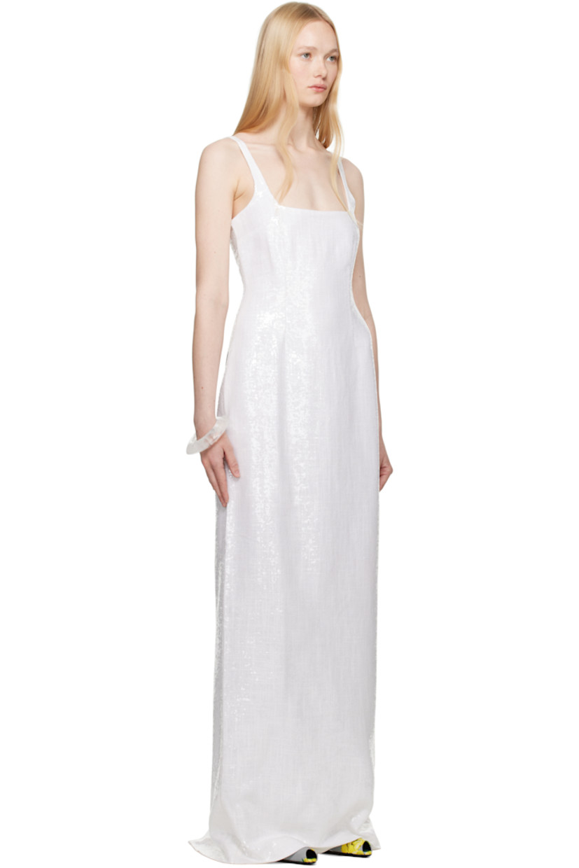 Sequinned plain-woven polyester maxi dress.

· Straight neck
· Darts at bodice
· Fixed shoulder straps
· Concealed zip closure at back
· Central slit at back hem
· Full crêpe lining

Supplier color: White