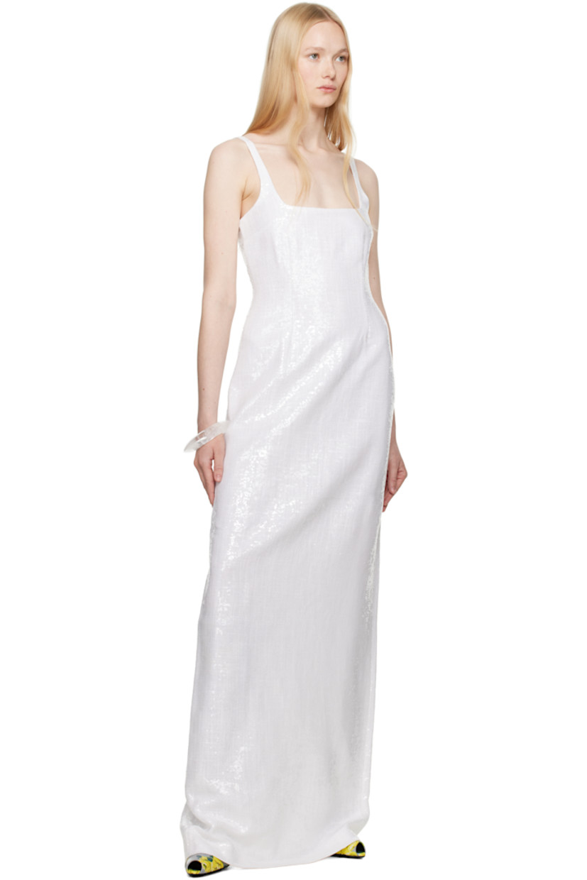 Sequinned plain-woven polyester maxi dress.

· Straight neck
· Darts at bodice
· Fixed shoulder straps
· Concealed zip closure at back
· Central slit at back hem
· Full crêpe lining

Supplier color: White
