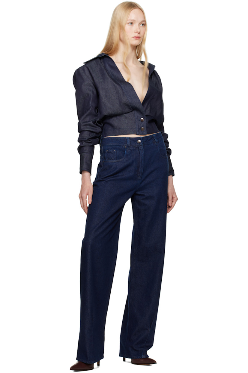 Non-stretch cotton- and lyocell-blend denim jacket.

· Spread collar
· Tucks at open front
· Button fastening at front hem
· Dropped shoulders
· Gathering at sleeves
· Pleat at buttoned barrel cuffs
· Mock button tabs at elasticized back hem
· Full satin lining
· Logo-engraved gunmetal-tone hardware

Supplier color: Blue