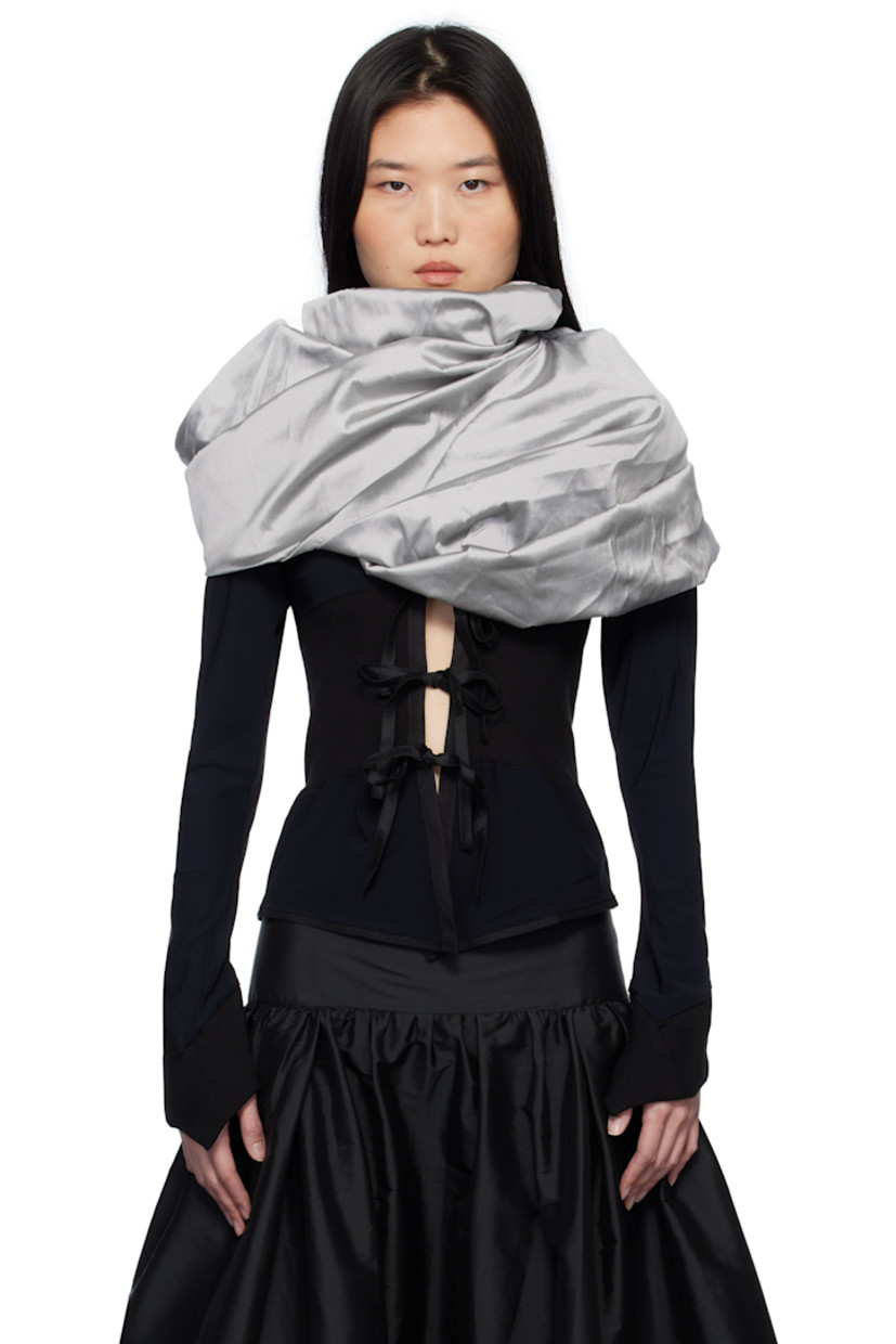 Stretch nylon jersey cardigan. Integrated polyester taffeta gigot sleeve shawl-style overlay with pagoda shoulders.

· Rib-knit trim throughout
· Round neck
· Self-tie fastenings at open front
· Flared cuffs

Supplier color: Black & Grey