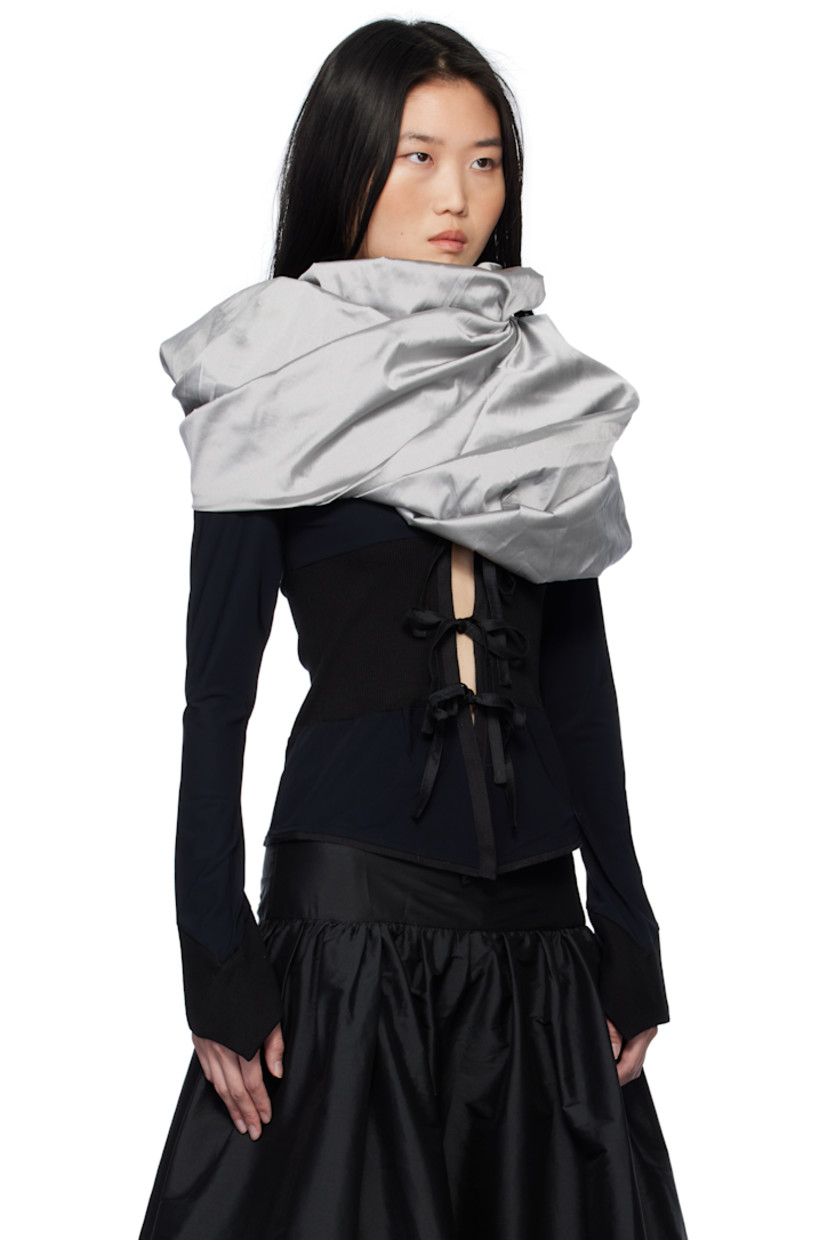 Stretch nylon jersey cardigan. Integrated polyester taffeta gigot sleeve shawl-style overlay with pagoda shoulders.

· Rib-knit trim throughout
· Round neck
· Self-tie fastenings at open front
· Flared cuffs

Supplier color: Black & Grey
