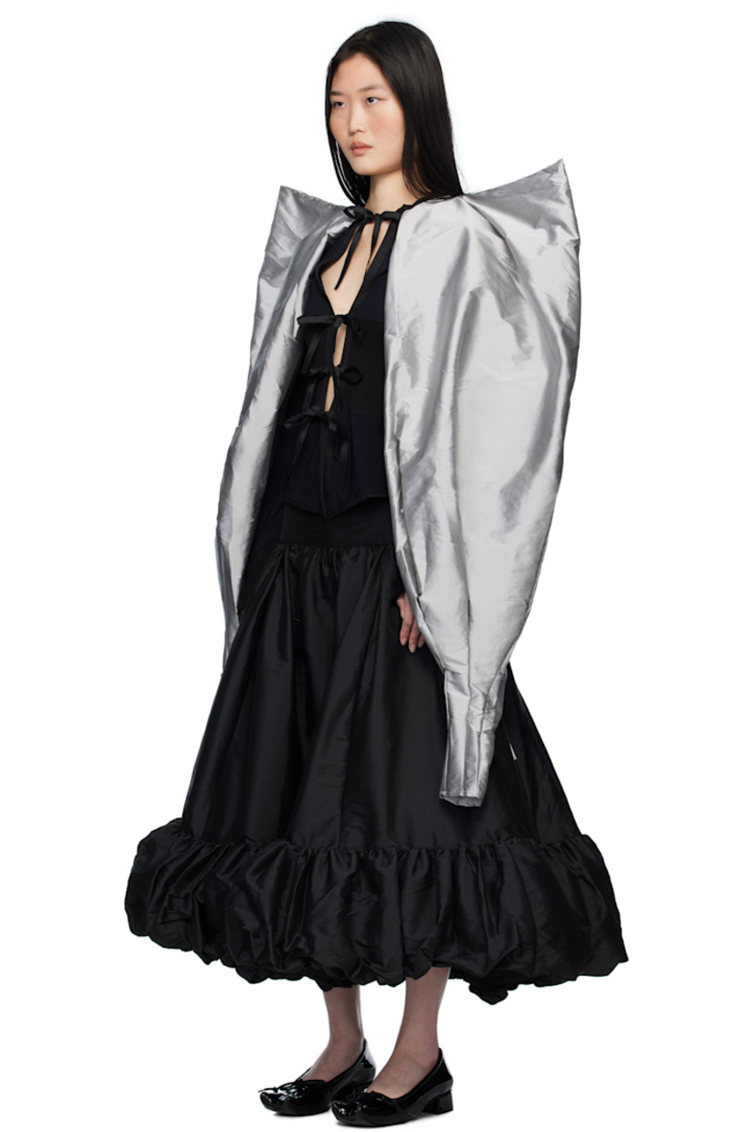 Stretch nylon jersey cardigan. Integrated polyester taffeta gigot sleeve shawl-style overlay with pagoda shoulders.

· Rib-knit trim throughout
· Round neck
· Self-tie fastenings at open front
· Flared cuffs

Supplier color: Black & Grey