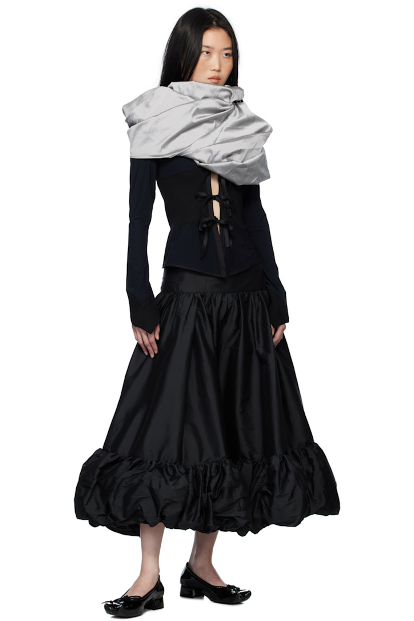 Stretch nylon jersey cardigan. Integrated polyester taffeta gigot sleeve shawl-style overlay with pagoda shoulders.

· Rib-knit trim throughout
· Round neck
· Self-tie fastenings at open front
· Flared cuffs

Supplier color: Black & Grey