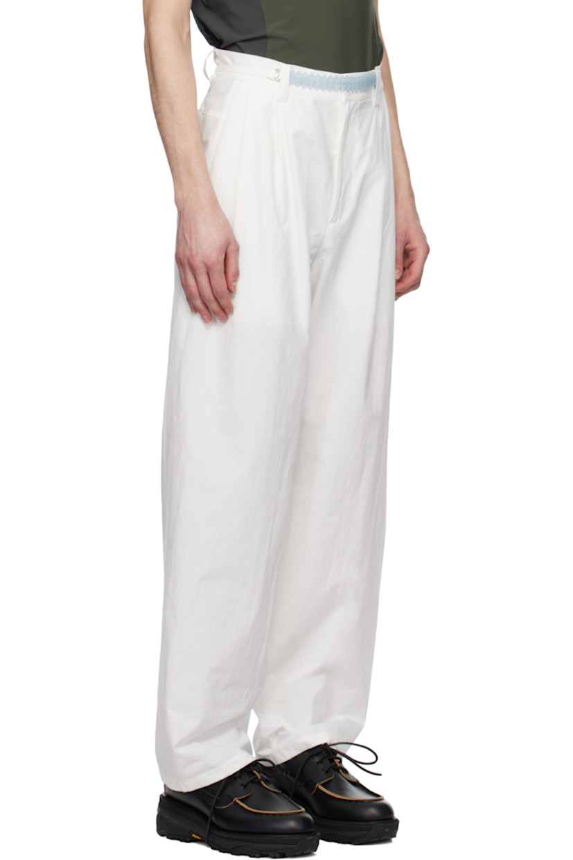 Cotton poplin trousers.

· Belt loops
· Self-tie belt with beaded detailing at waistband
· Four-pocket styling
· Zip-fly
· Pleats at front

Supplier color: White