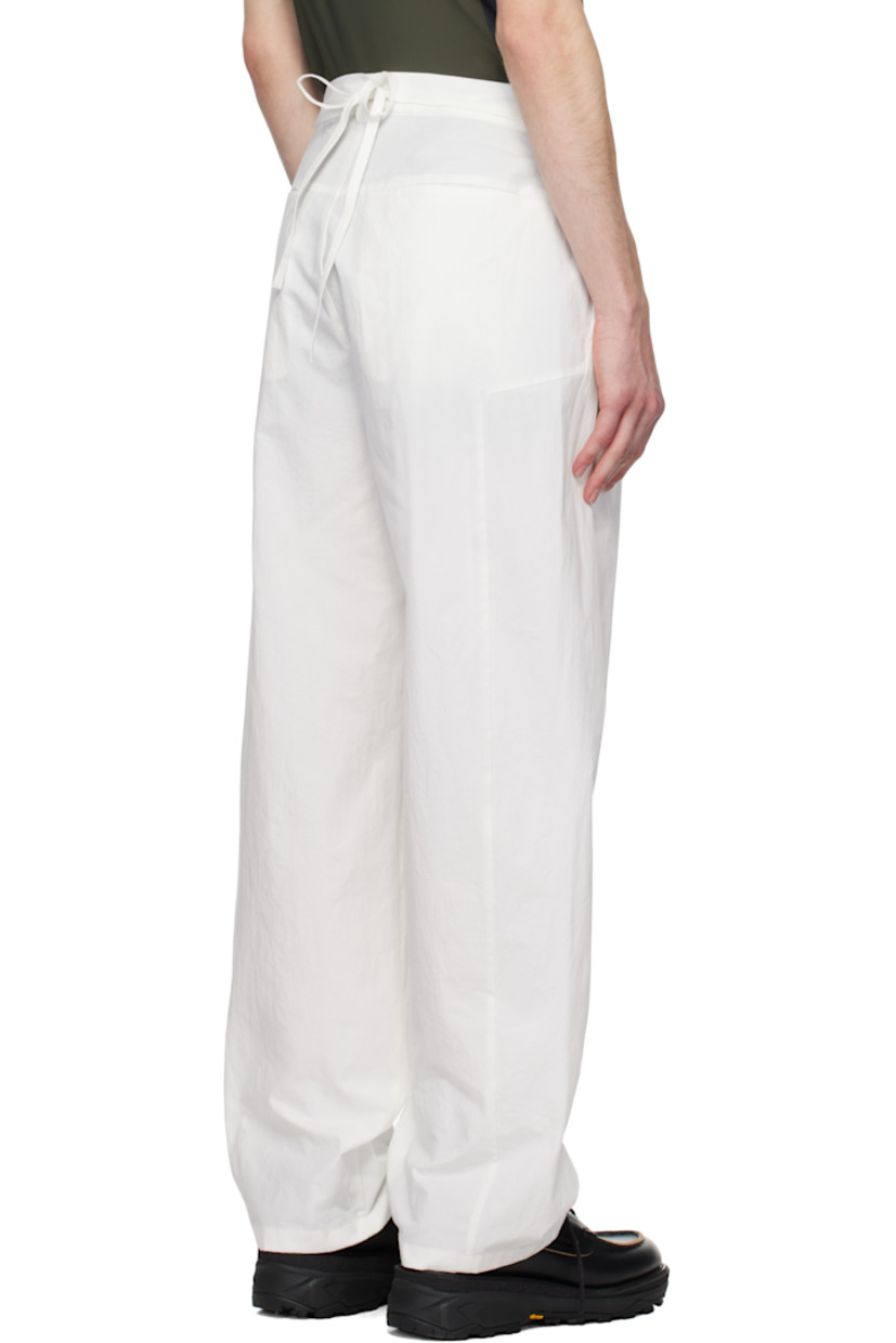 Cotton poplin trousers.

· Belt loops
· Self-tie belt with beaded detailing at waistband
· Four-pocket styling
· Zip-fly
· Pleats at front

Supplier color: White