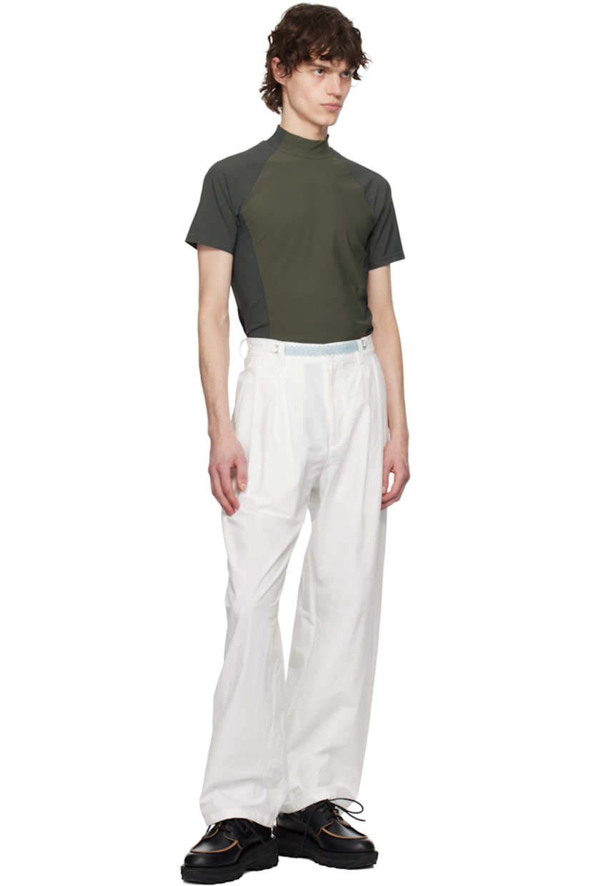 Cotton poplin trousers.

· Belt loops
· Self-tie belt with beaded detailing at waistband
· Four-pocket styling
· Zip-fly
· Pleats at front

Supplier color: White