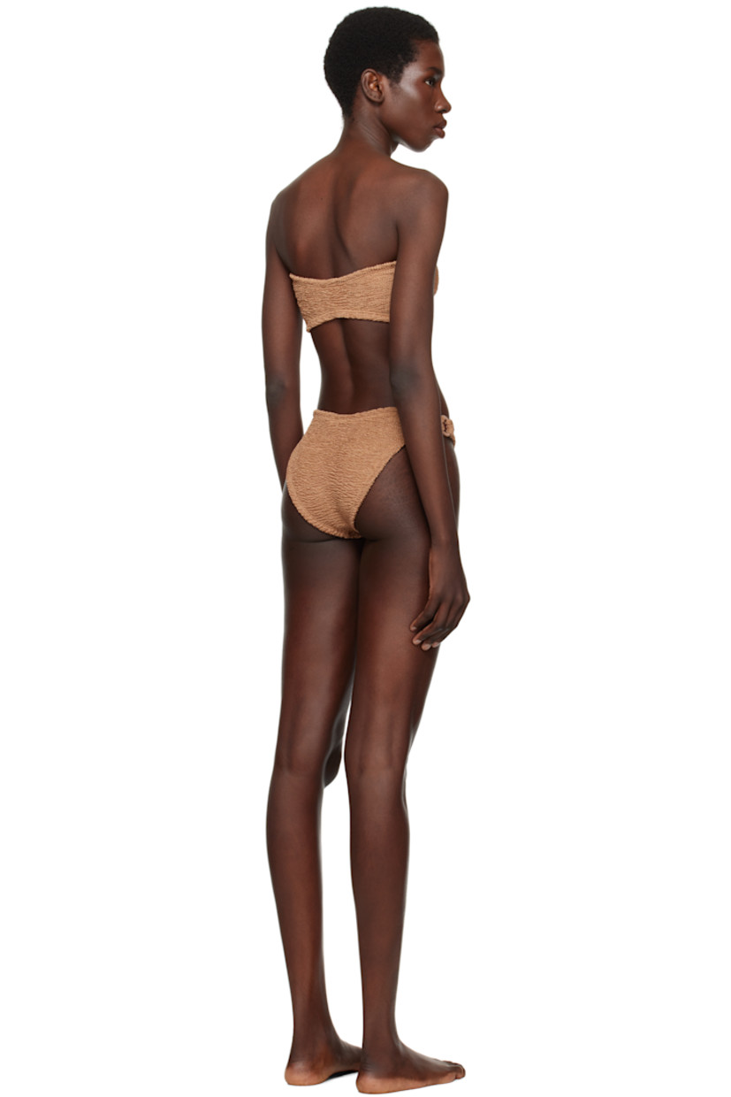 Shirred stretch nylon jersey bandeau-style bikini top.

· Sweetheart neck
· O-ring and gathering at chest
· Unlined

Shirred stretch nylon jersey bikini bottom.

· Elasticized waistband
· O-ring at sides
· Unlined

This product uses Original Crinkle™ Technology. Fits US sizes 2-12.

Supplier color: Metallic cocao