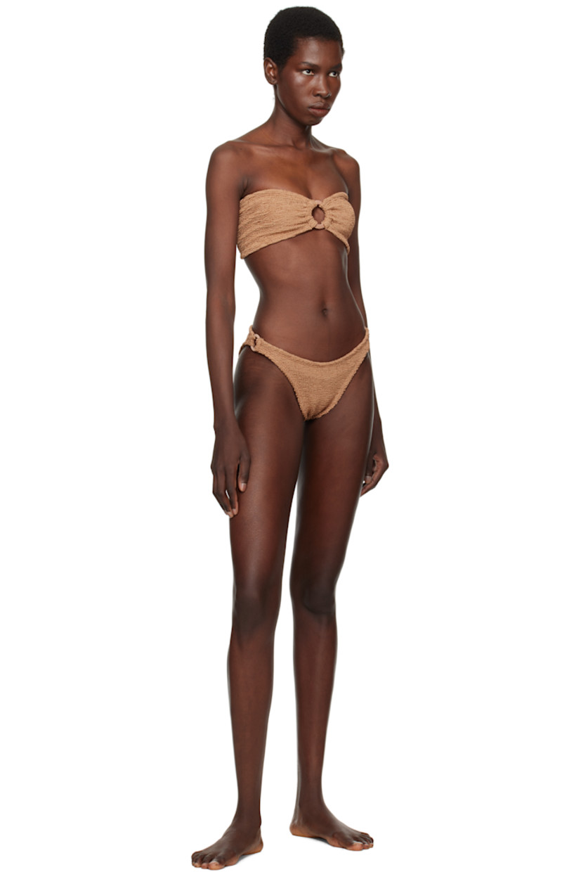 Shirred stretch nylon jersey bandeau-style bikini top.

· Sweetheart neck
· O-ring and gathering at chest
· Unlined

Shirred stretch nylon jersey bikini bottom.

· Elasticized waistband
· O-ring at sides
· Unlined

This product uses Original Crinkle™ Technology. Fits US sizes 2-12.

Supplier color: Metallic cocao