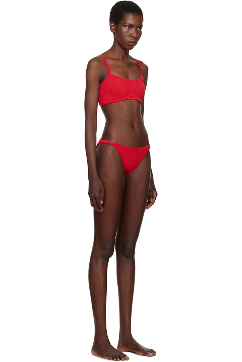 Shirred stretch nylon jersey bikini top.

· Square neck
· Fixed spaghetti straps
· Unlined

Shirred stretch nylon jersey bikini bottom.

· Elasticized waistband
· Unlined

This product uses Original Crinkle™ Technology. Fits US sizes 2-12.

Supplier color: Red
