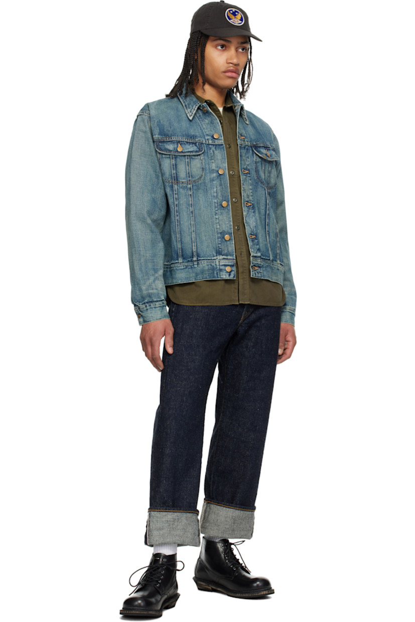 Non-stretch denim jacket. Fading and subtle distressing throughout.

· Spread collar
· Button closure
· Flap pockets
· Logo patch at pocket
· Buttoned barrel cuffs
· Adjustable button tabs at back hem
· Logo-engraved gold-tone hardware
· Contrast stitching in tan

Supplier color: Leeland wash