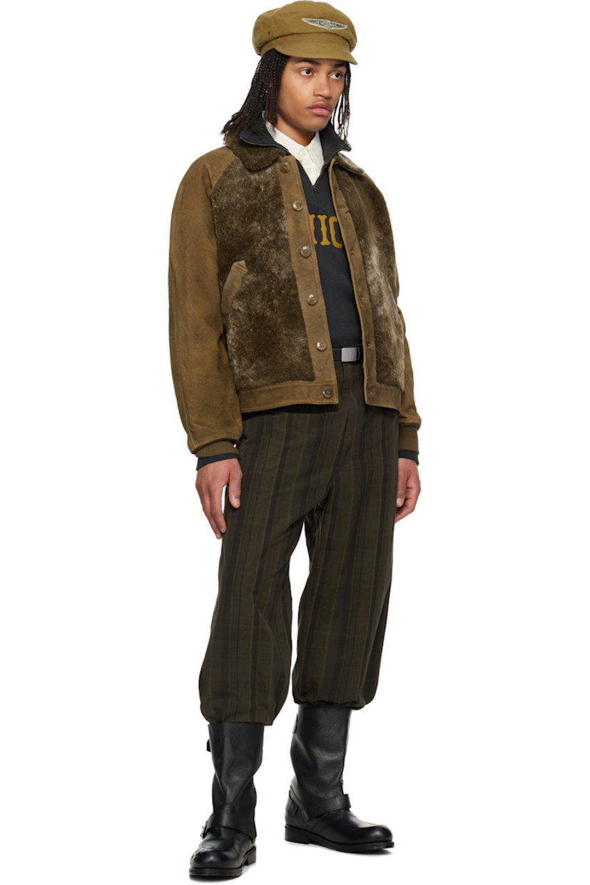 Suede and lambskin shearling jacket. 

· Paneled construction 
· Spread collar
· Button closure
· Welt pockets
· Raglan sleeves
· Rib-knit cuffs
· Inverted box pleat at yoke 
· Adjustable cinch tabs at back hem 
· Welt pocket at interior 
· Check pattern at yarn-dyed cotton flannel lining 
· Brushed chamois pocket lining 
· Corozo hardware 

Supplier color: Vintage brown