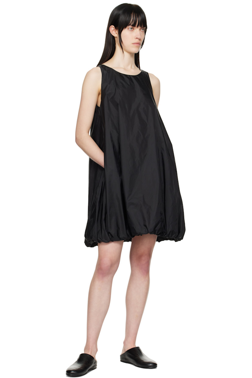 Lightweight nylon taffeta minidress.

· Round neck
· Seam pockets
· Bubble hem
· Zip closure at back
· Full mesh lining

Supplier color: Black
