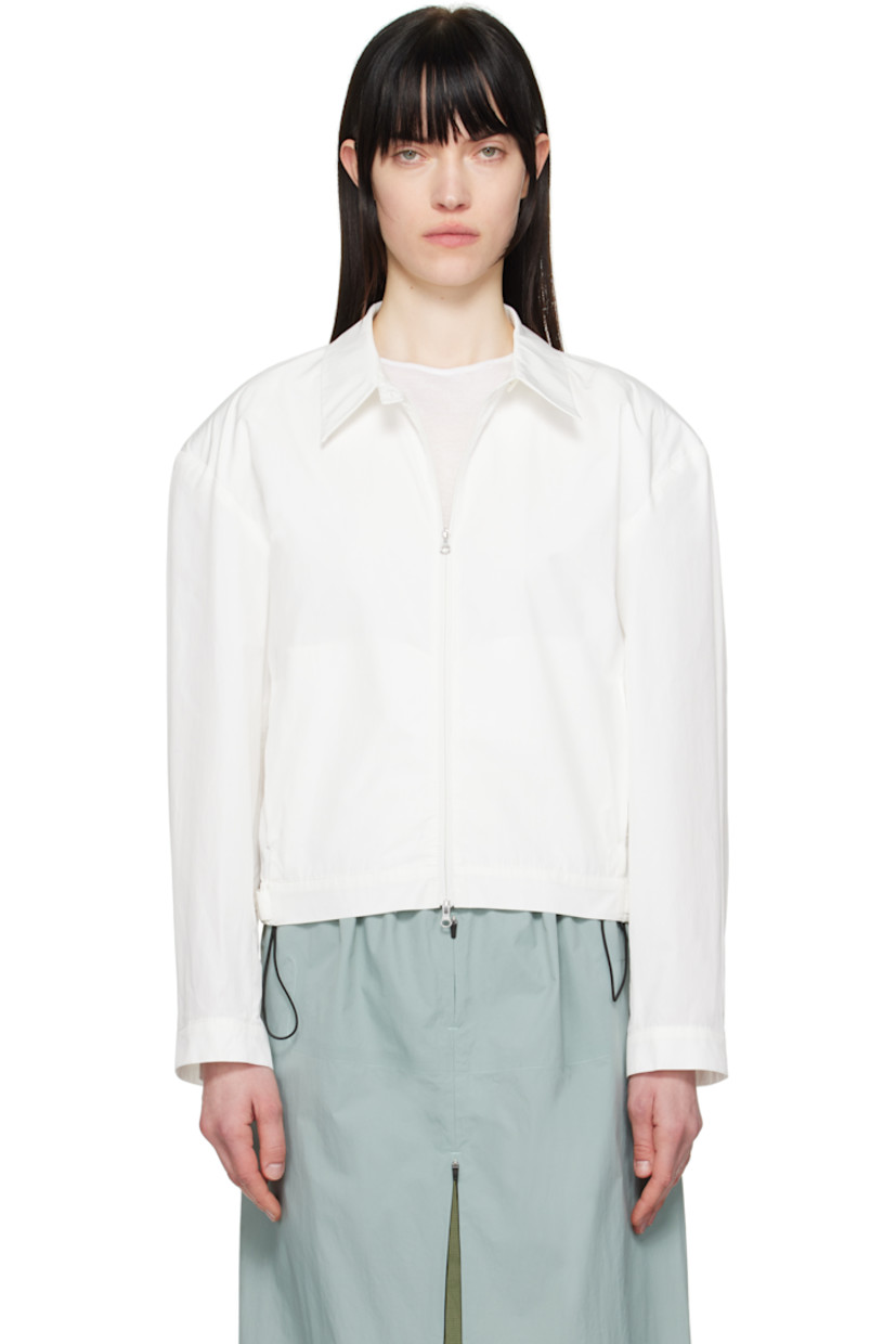 Lightweight crinkled polyester- and cotton-blend taffeta jacket.

· Button tab at spread collar
· Two-way zip closure 
· Darts at front 
· Seam pockets
· Partially elasticized cropped hem
· Adjustable button tab at cuffs
· Adjustable button tabs at back hem

Supplier color: White