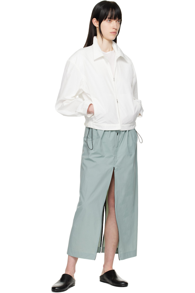 Lightweight crinkled polyester- and cotton-blend taffeta jacket.

· Button tab at spread collar
· Two-way zip closure 
· Darts at front 
· Seam pockets
· Partially elasticized cropped hem
· Adjustable button tab at cuffs
· Adjustable button tabs at back hem

Supplier color: White