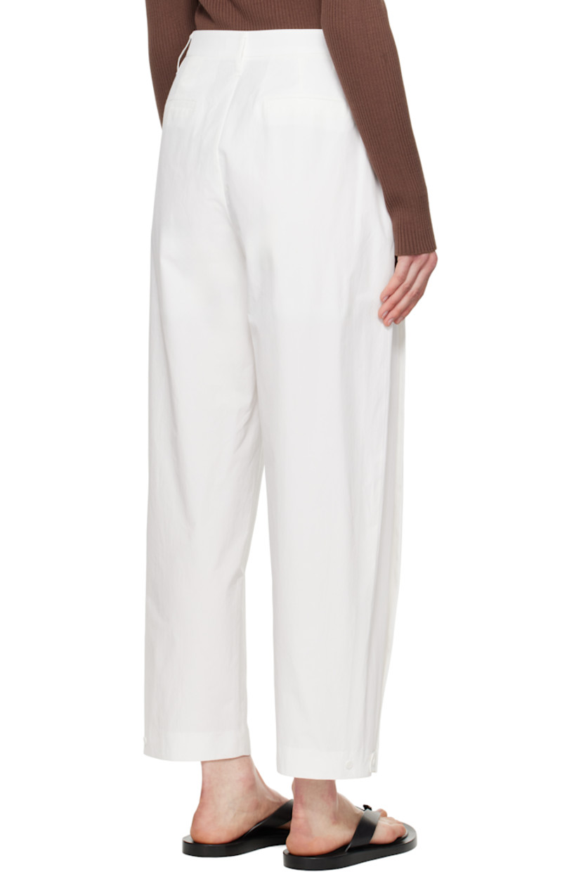 Lightweight polyester- and cotton-blend poplin trousers.

· High-rise
· Belt loops
· Four-pocket styling
· Zip fly
· Pleats at front 
· Adjustable button tab at cuffs
· Darts at back waistband

Supplier color: White