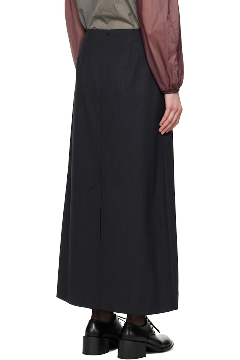Textured plain-woven wool-blend maxi skirt. 

· Darts at front and back waistband
· Welt pockets
· Zip closure at back 
· Central vent at back hem
· Partial sateen lining

Supplier color: Black