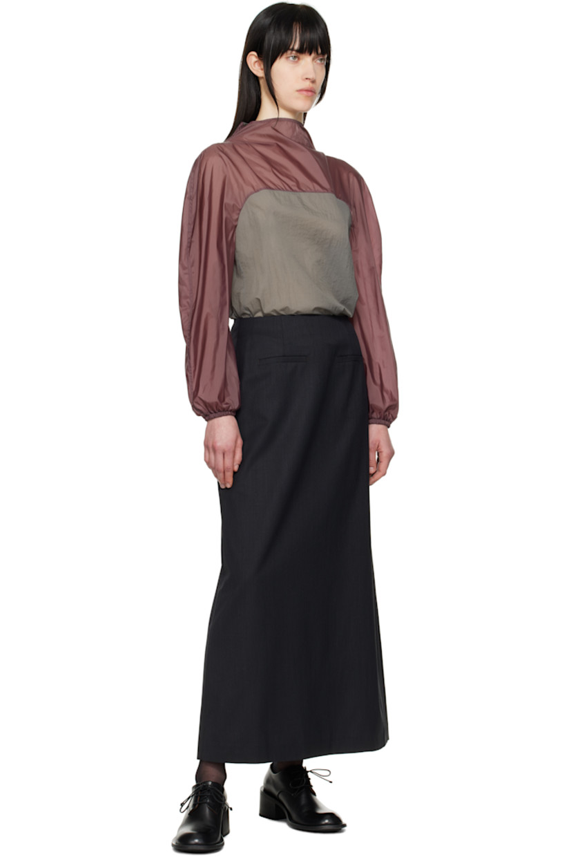 Textured plain-woven wool-blend maxi skirt. 

· Darts at front and back waistband
· Welt pockets
· Zip closure at back 
· Central vent at back hem
· Partial sateen lining

Supplier color: Black