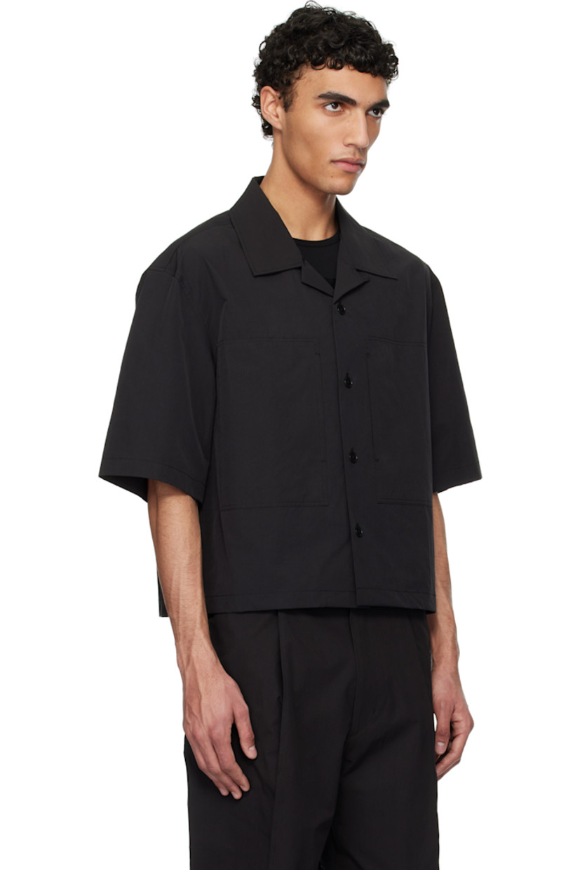 Oversized polyester- and cotton-blend poplin shirt.

· Open spread collar
· Button closure
· Patch pockets
· Cropped hem
· Twin pleats at back yoke

Supplier color: Black