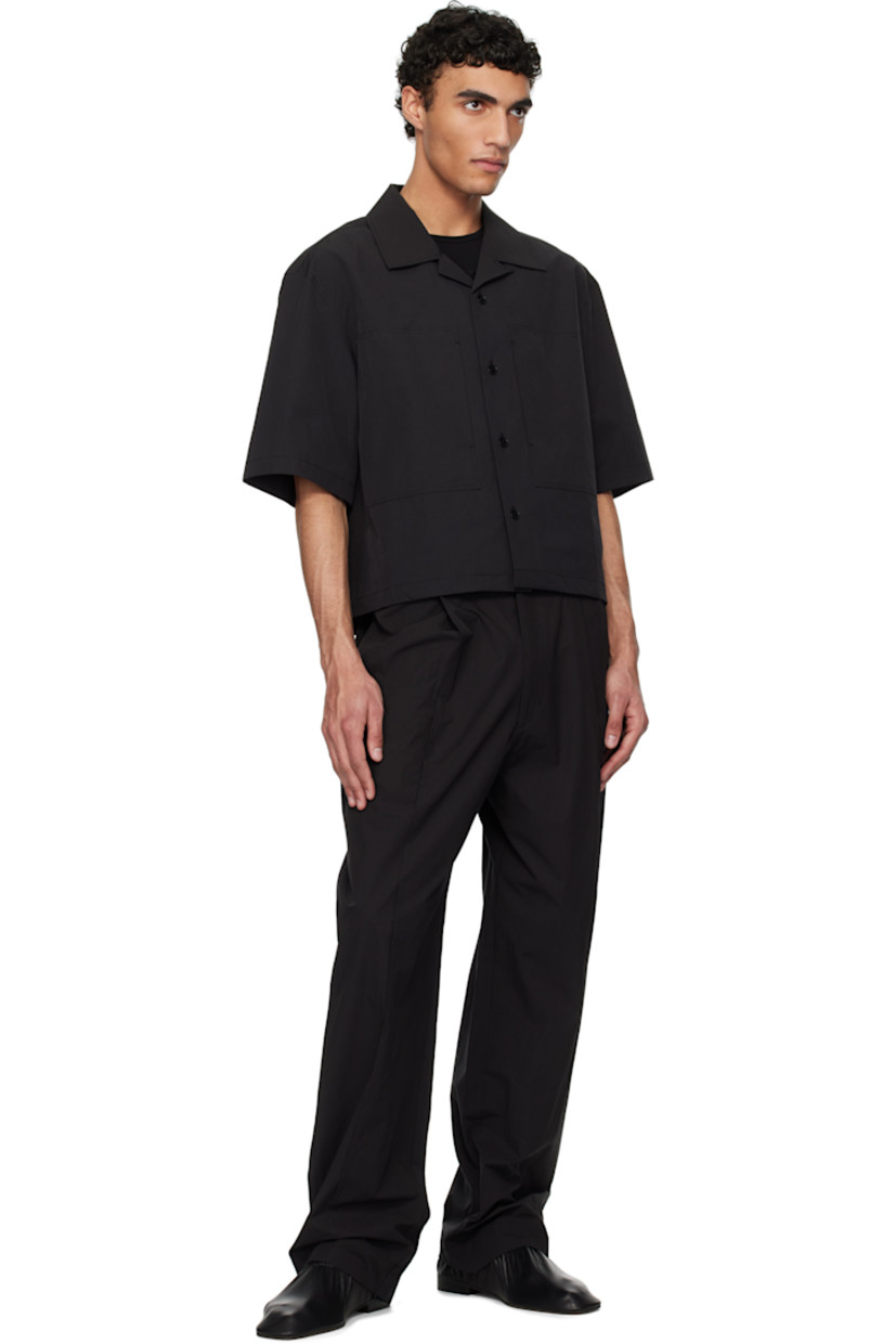Oversized polyester- and cotton-blend poplin shirt.

· Open spread collar
· Button closure
· Patch pockets
· Cropped hem
· Twin pleats at back yoke

Supplier color: Black