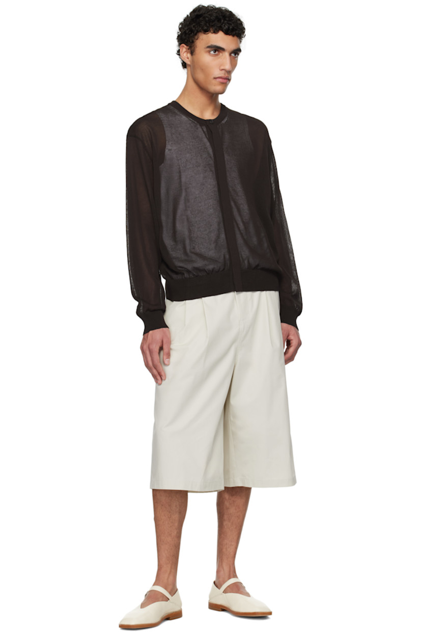 Lightweight semi-sheer knit cotton-blend cardigan.

· Rib-knit crewneck, hem, and cuffs
· Concealed button closure
· Dropped shoulders

Supplier color: Dark brown